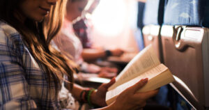 reading a book while travelling